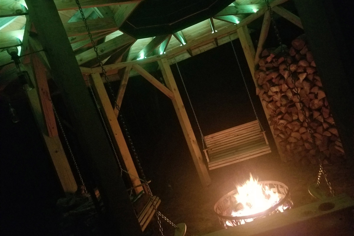 Gazebo with fire pit in use